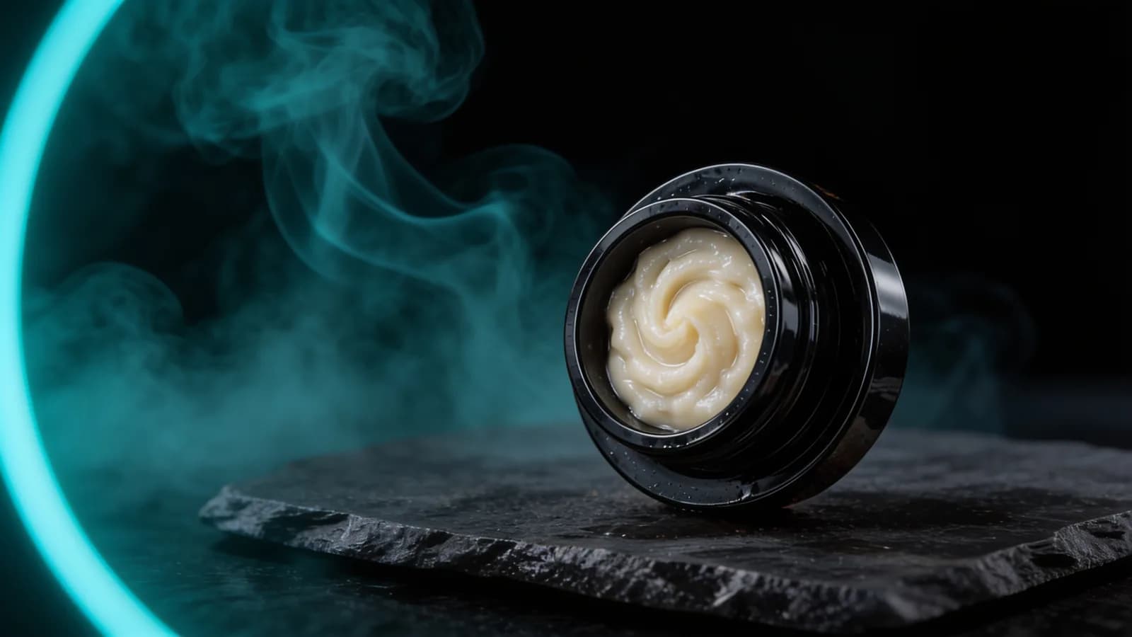 Jar of creamy white full melt live rosin — what is live rosin, dark studio scene