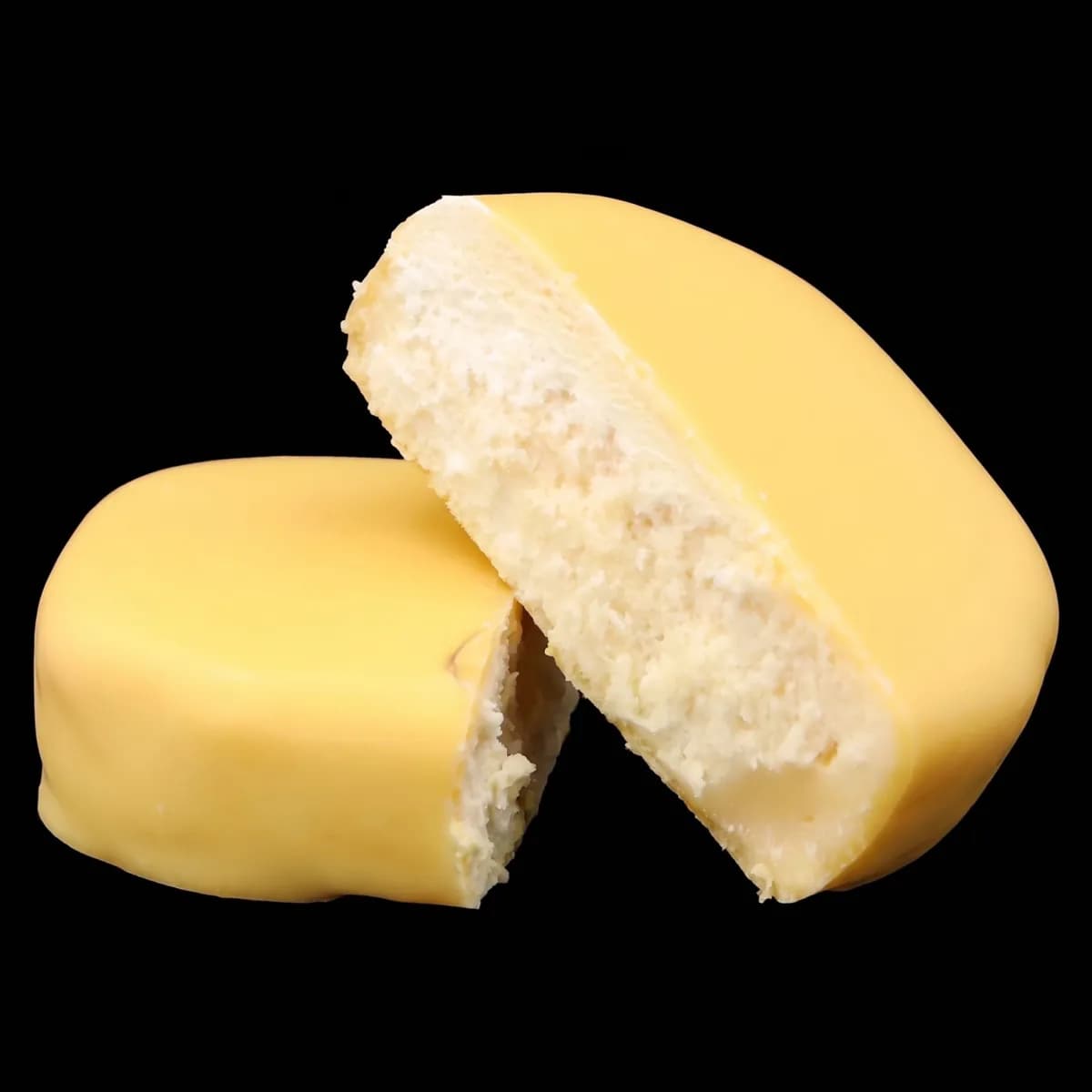Watermelon Bubblegum Full Melt Hash, a butter-yellow piece broken in two to show the sandy, pale cream inside